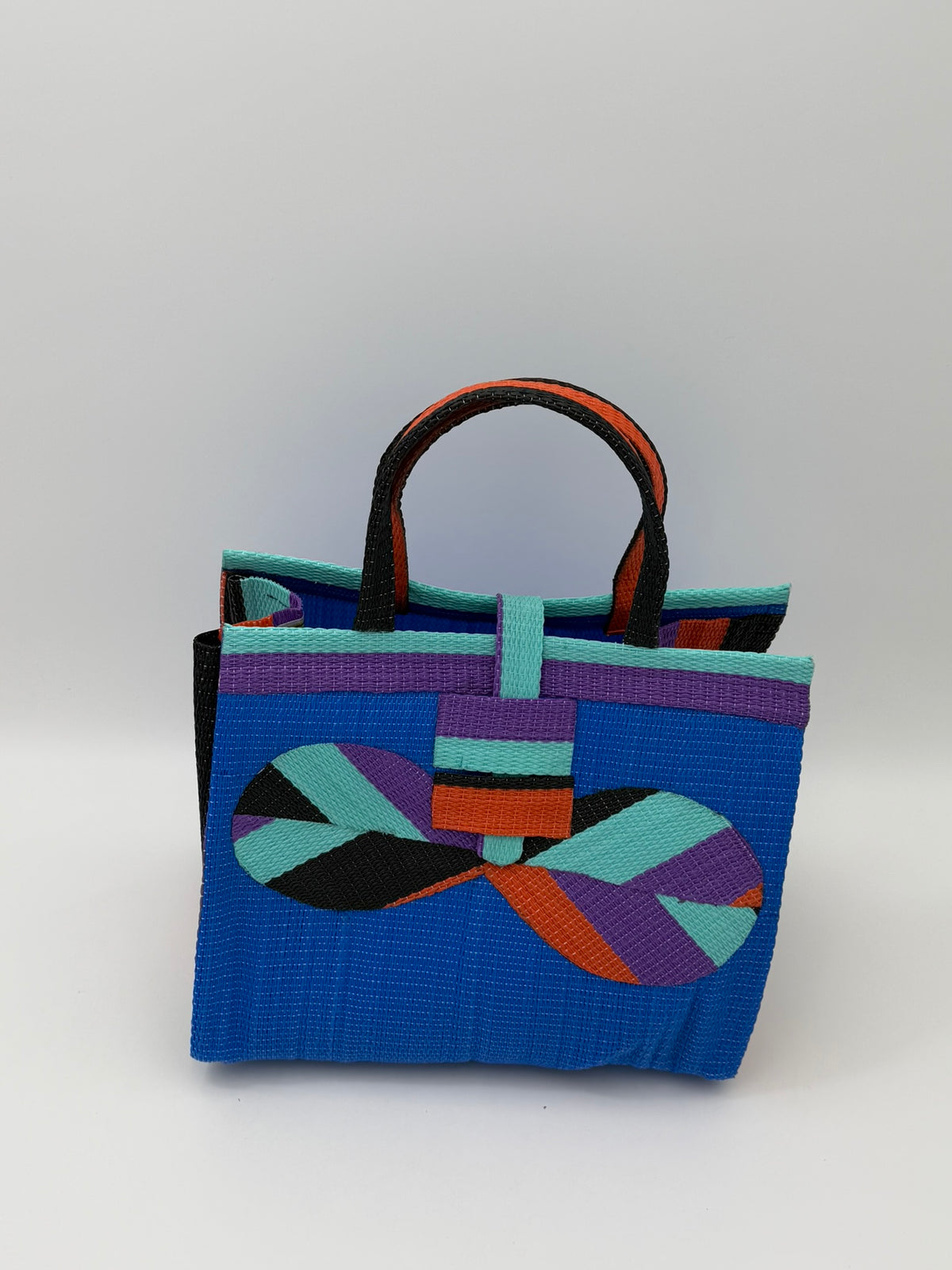 Lagoon Medium handwoven tote bag by SCRUBIES in Blue,Purple,Teal,Orange with Solid design and Bow accent pattern