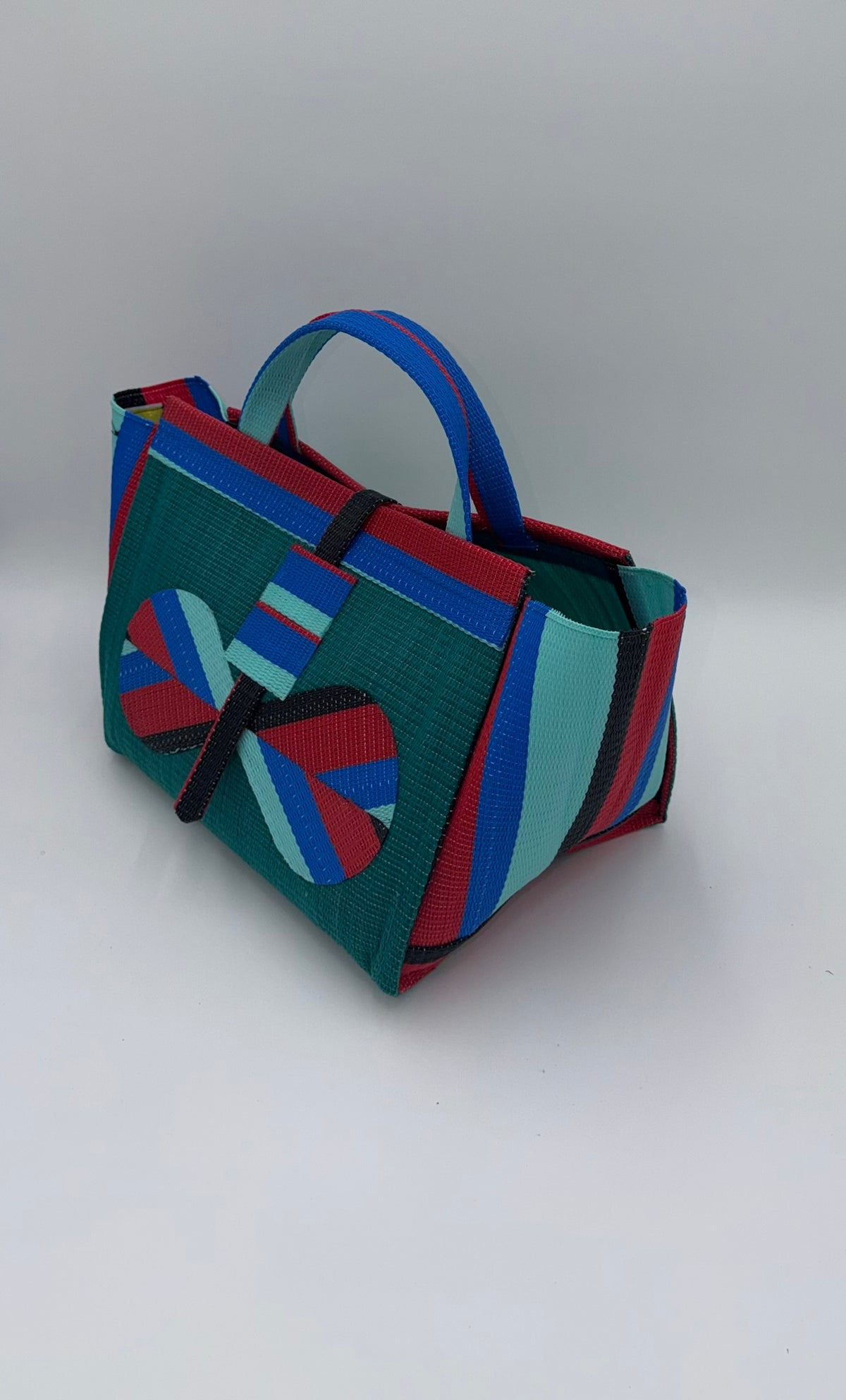 Emerald Large handwoven tote bag by SCRUBIES in Green,Red,Blue,Teal with Solid design and Bow accent pattern