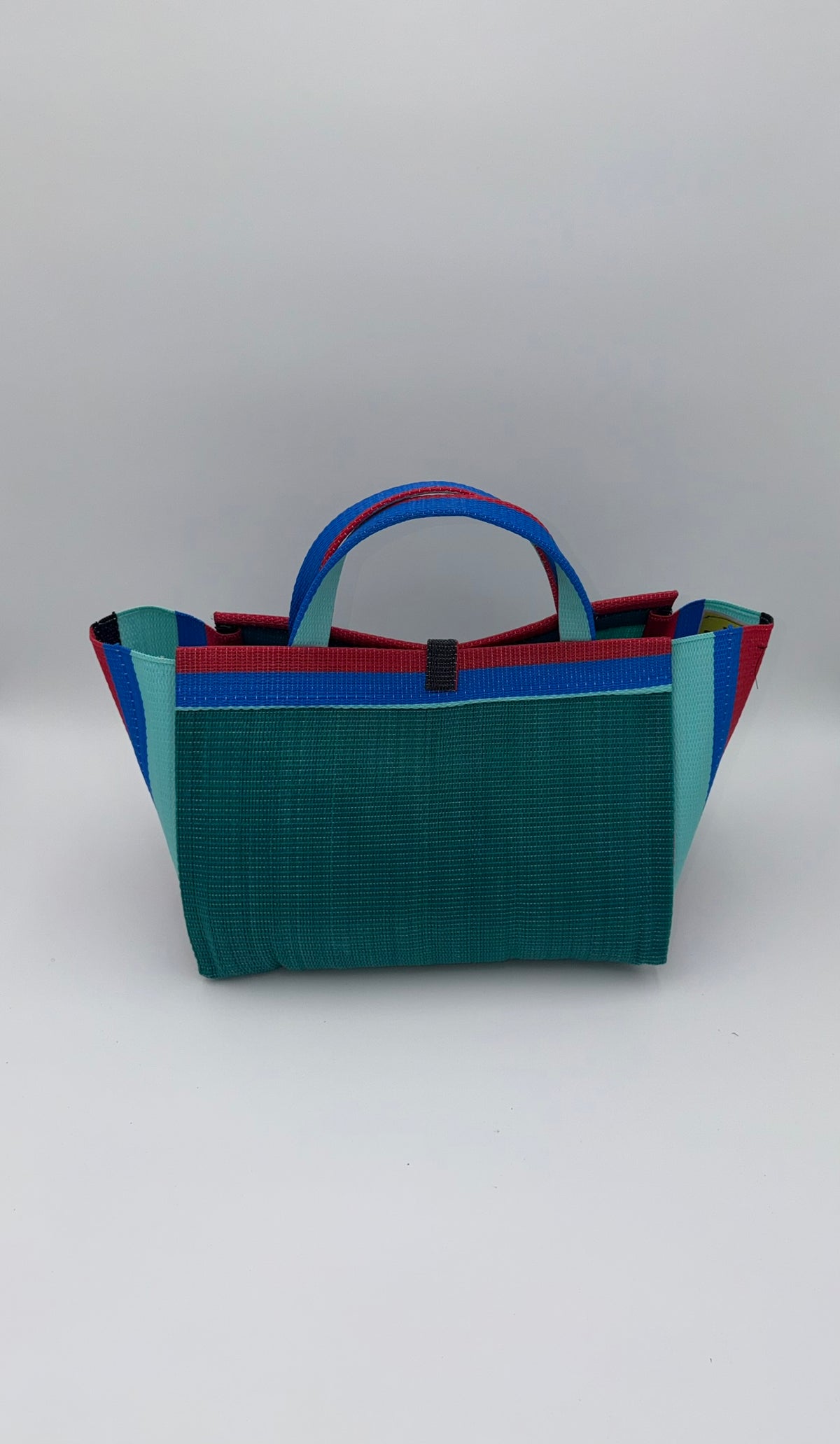 Emerald Large handwoven tote bag by SCRUBIES in Green,Red,Blue,Teal with Solid design and Bow accent pattern