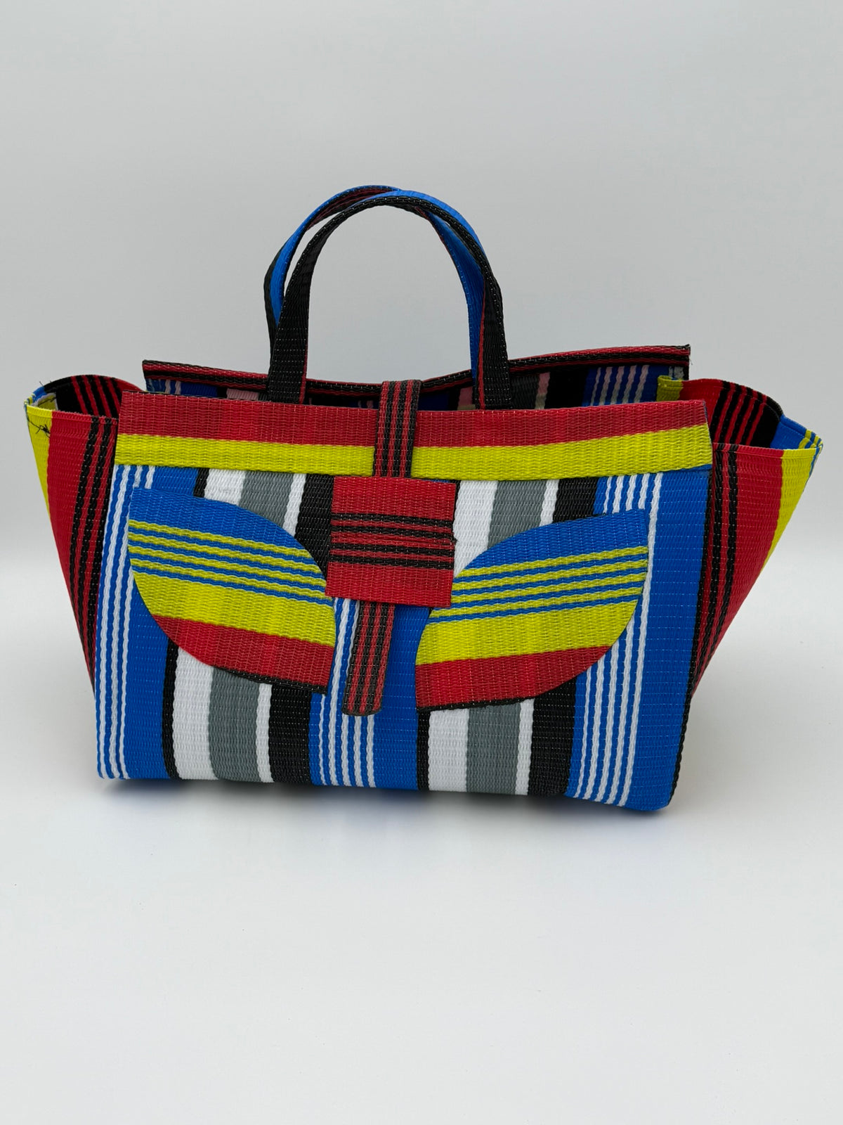 Regal Large handwoven tote bag by SCRUBIES in Red,Yellow,Blue,White,Black with Stripes design and Leaf accent pattern