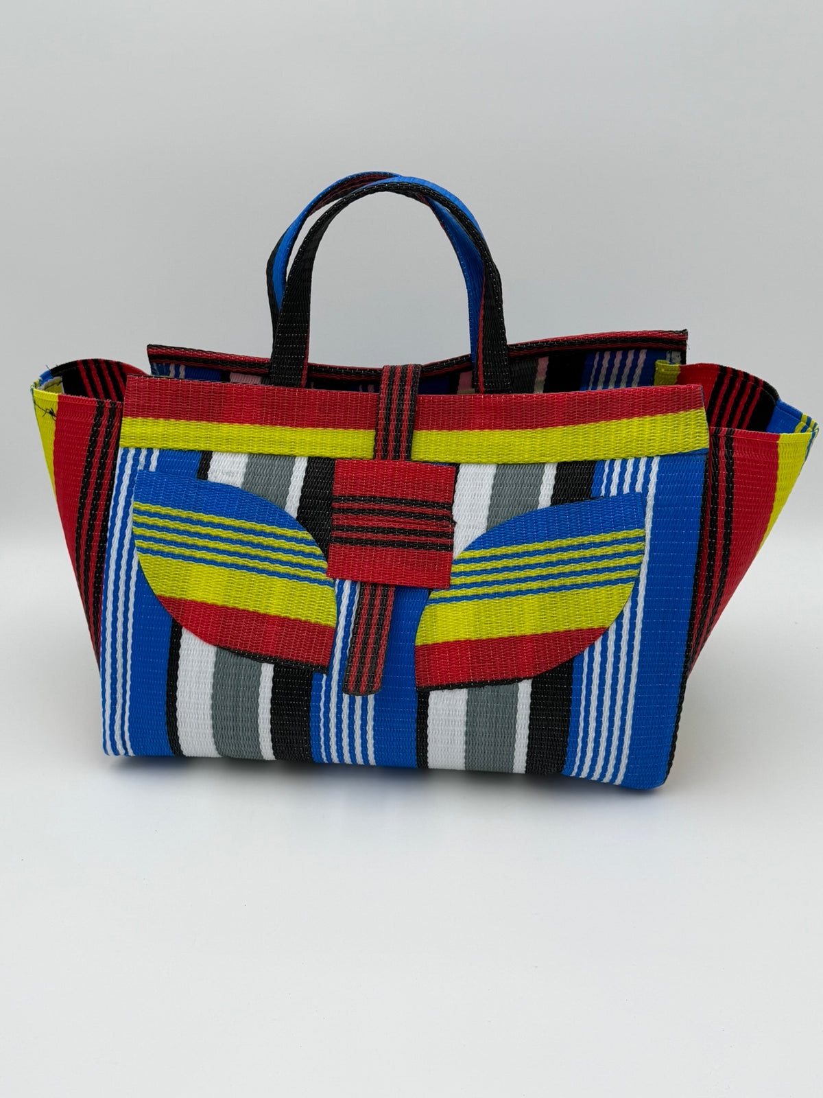 Regal Large handwoven tote bag by SCRUBIES in Red,Yellow,Blue,White,Black with Stripes design and Leaf accent pattern