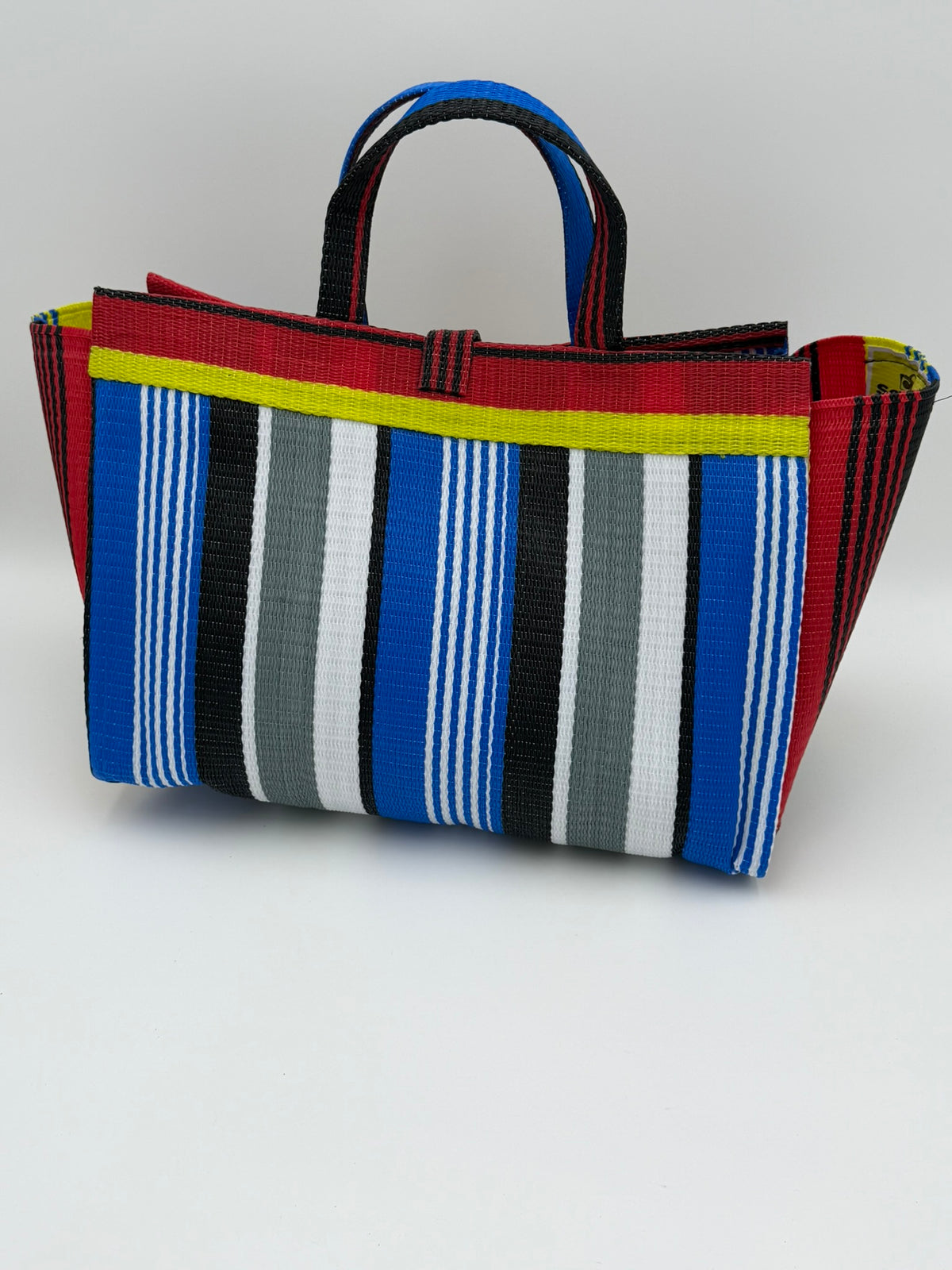 Regal Large handwoven tote bag by SCRUBIES in Red,Yellow,Blue,White,Black with Stripes design and Leaf accent pattern