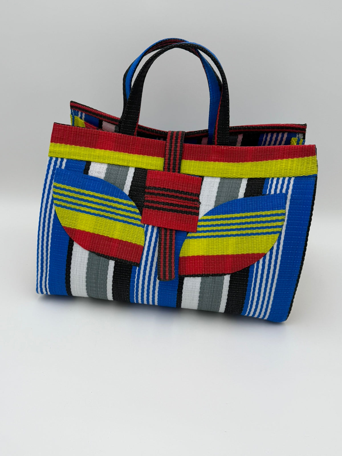 Regal Large handwoven tote bag by SCRUBIES in Red,Yellow,Blue,White,Black with Stripes design and Leaf accent pattern