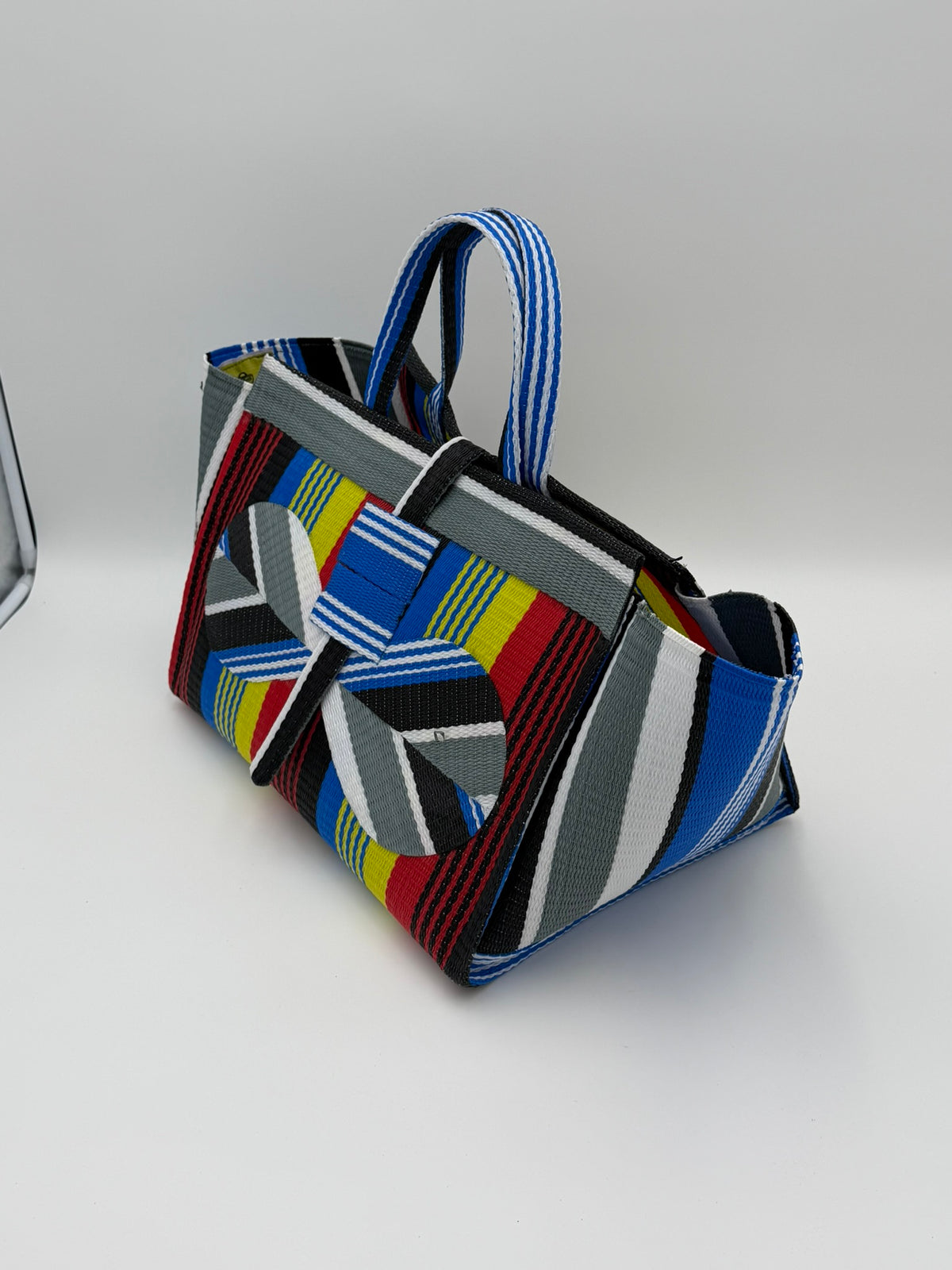 Regal Large handwoven tote bag by SCRUBIES in Red,Yellow,Blue,White,Black with Stripes design and Bow accent pattern