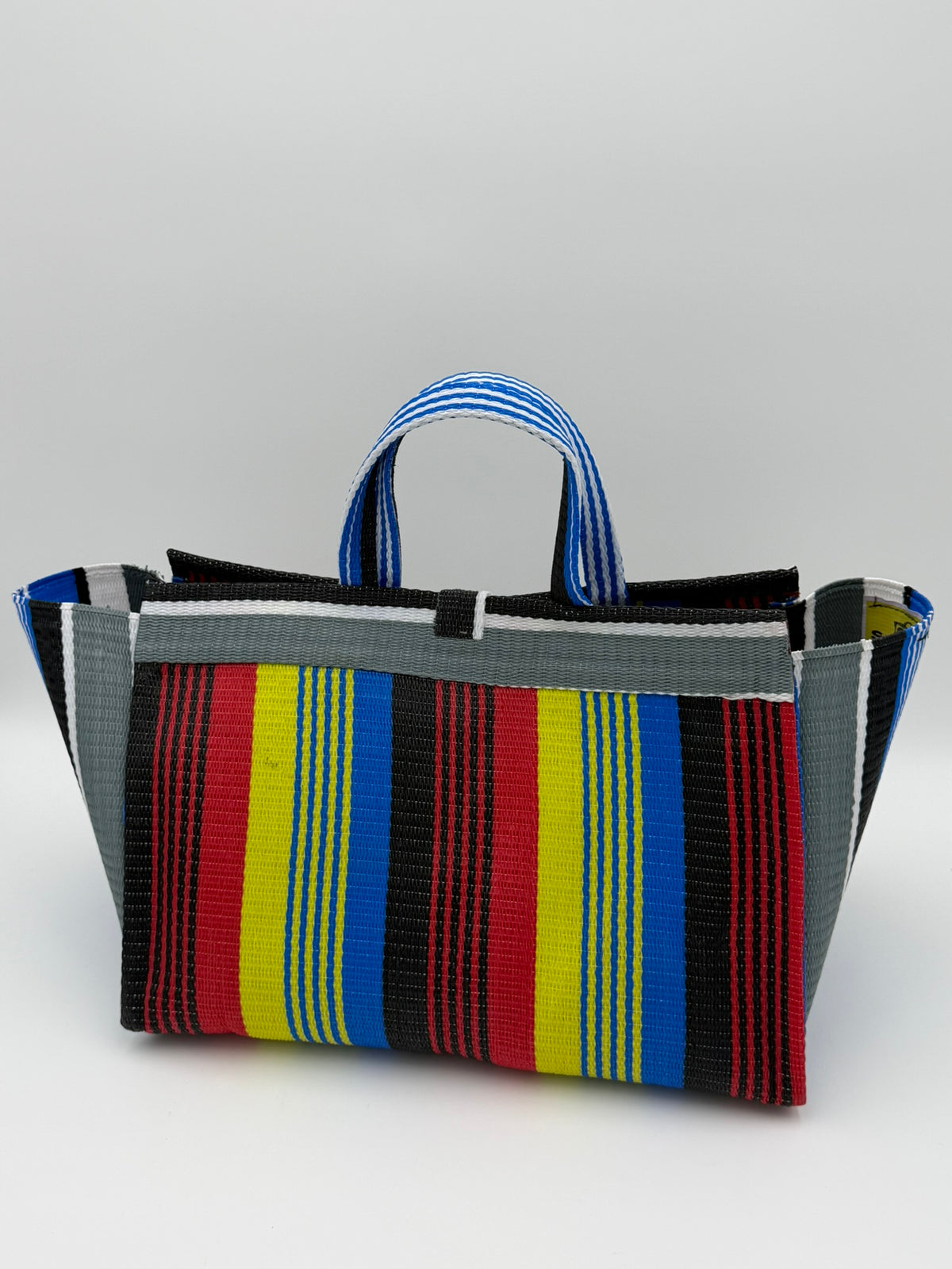 Regal Large handwoven tote bag by SCRUBIES in Red,Yellow,Blue,White,Black with Stripes design and Bow accent pattern