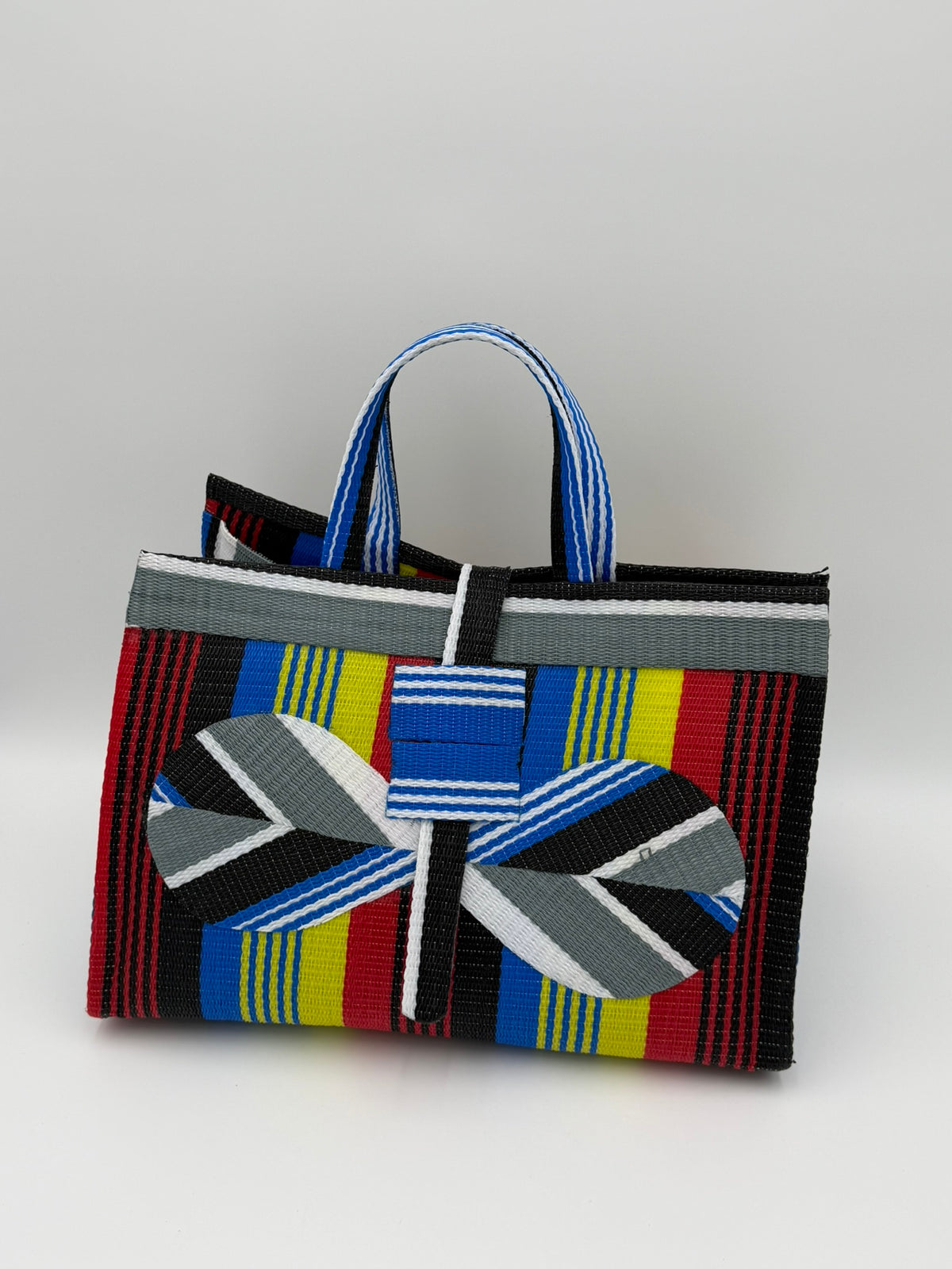 Regal Large handwoven tote bag by SCRUBIES in Red,Yellow,Blue,White,Black with Stripes design and Bow accent pattern