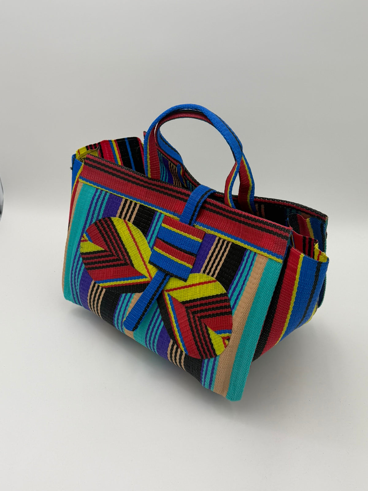 Africana Large handwoven tote bag by SCRUBIES in Red,Yellow,Teal,Purple,Beige,Black with Stripes design and Bow accent pattern