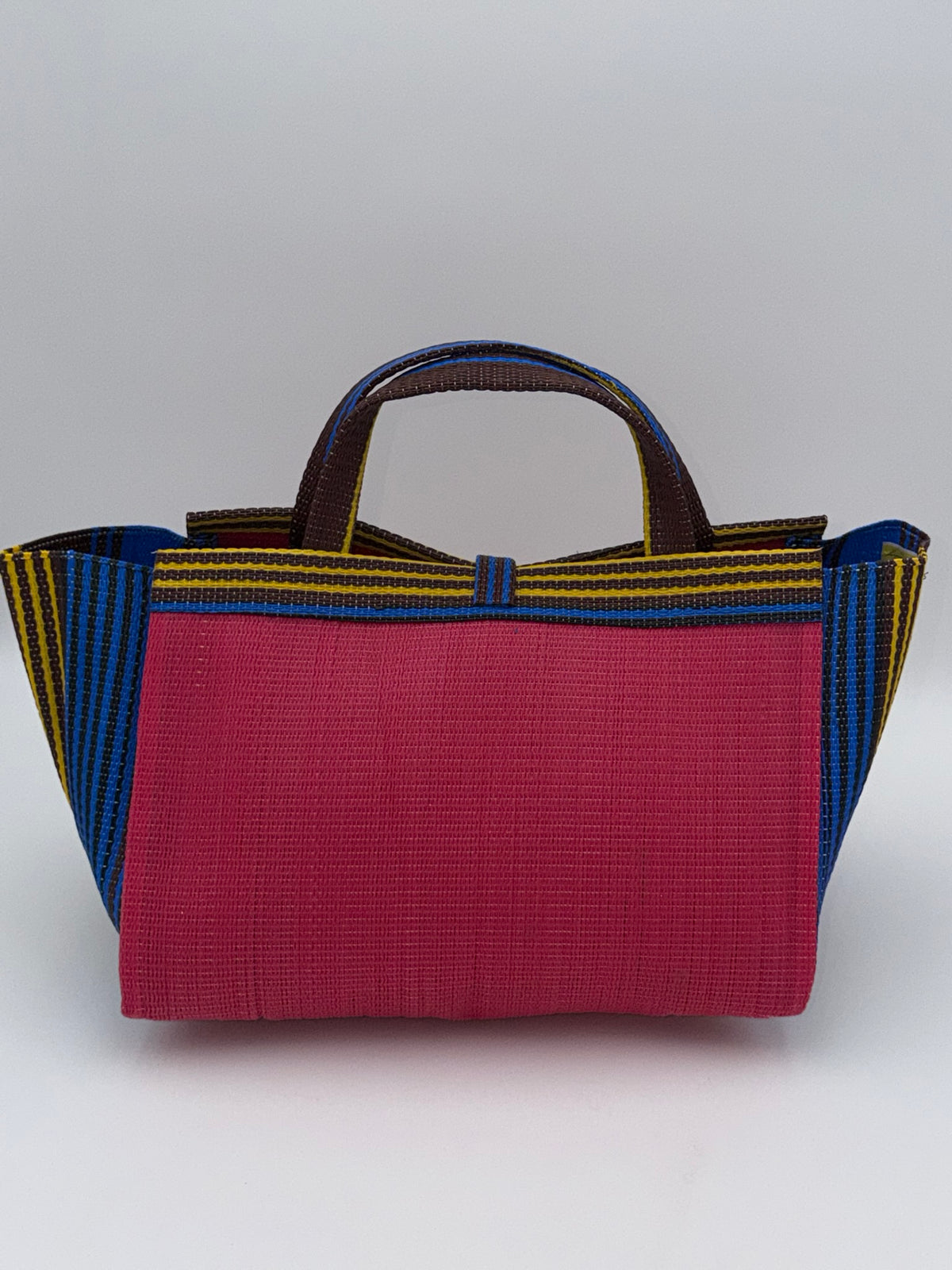 Candy Large handwoven tote bag by SCRUBIES in Pink,Blue,Brown,Yellow with Solid design and Bow accent pattern