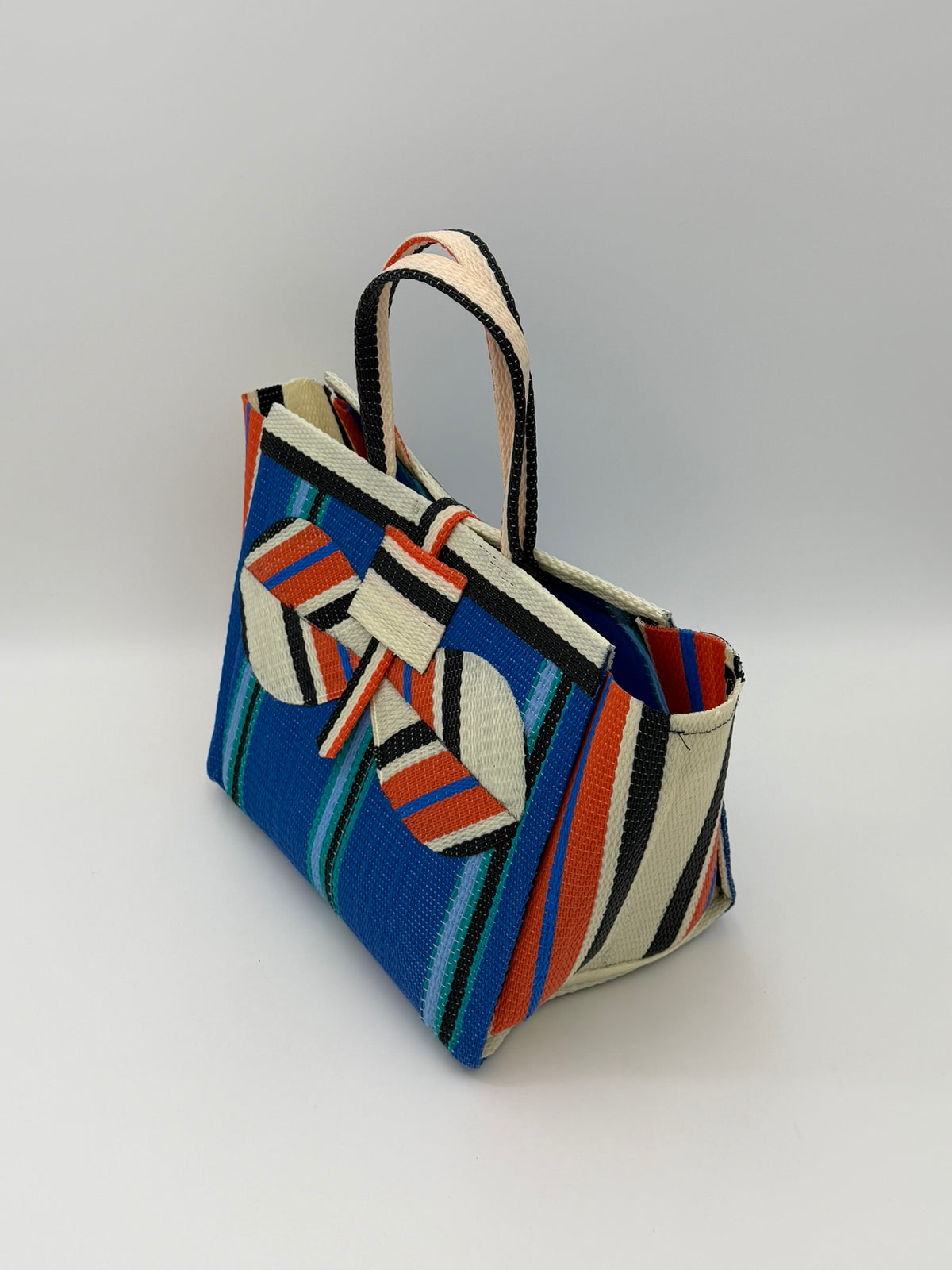 Lagoon Medium  handwoven tote bag by SCRUBIES in Blue,Orange,Cream,Black with Stripes design and Bow accent pattern