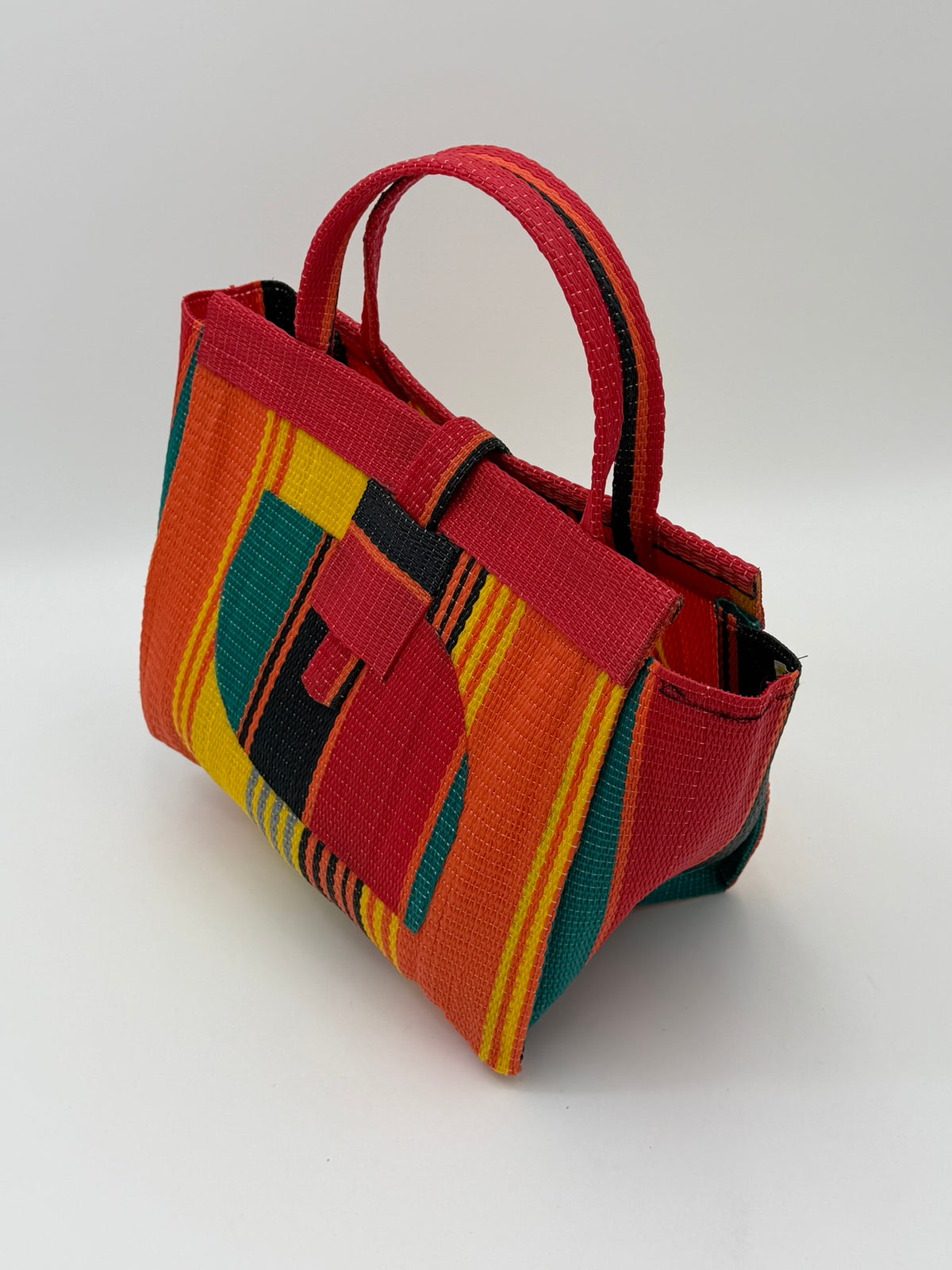 Citrus Medium  handwoven tote bag by SCRUBIES in Orange,Red,Yellow,Green,Black with Stripes design and Almond accent pattern