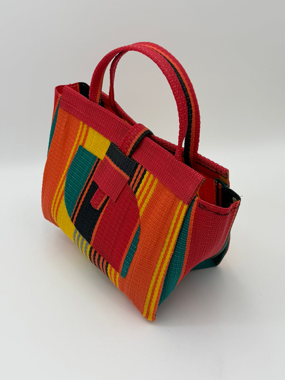 Citrus Medium  handwoven tote bag by SCRUBIES in Orange,Red,Yellow,Green,Black with Stripes design and Almond accent pattern
