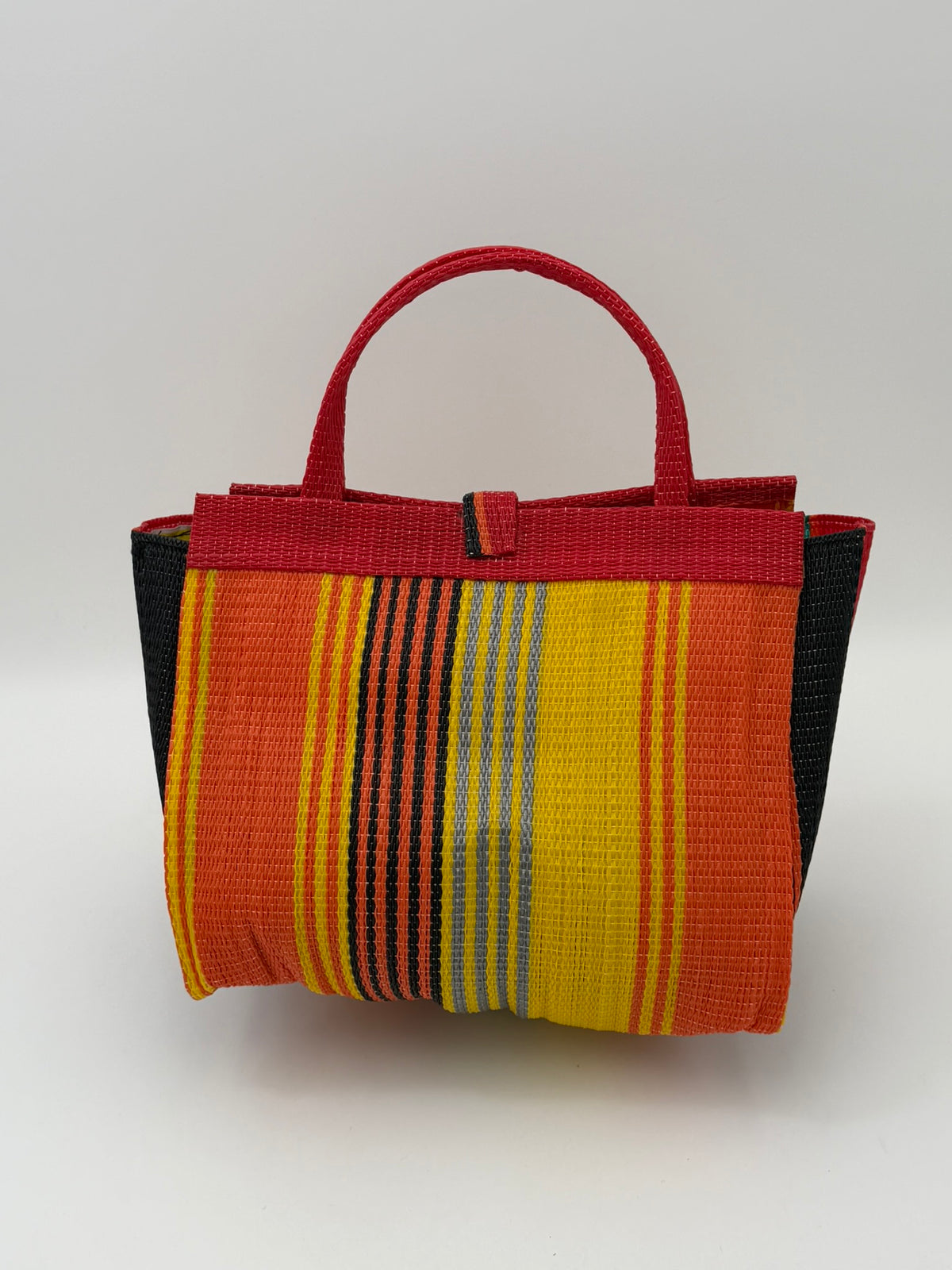 Citrus Medium  handwoven tote bag by SCRUBIES in Orange,Red,Yellow,Green,Black with Stripes design and Almond accent pattern