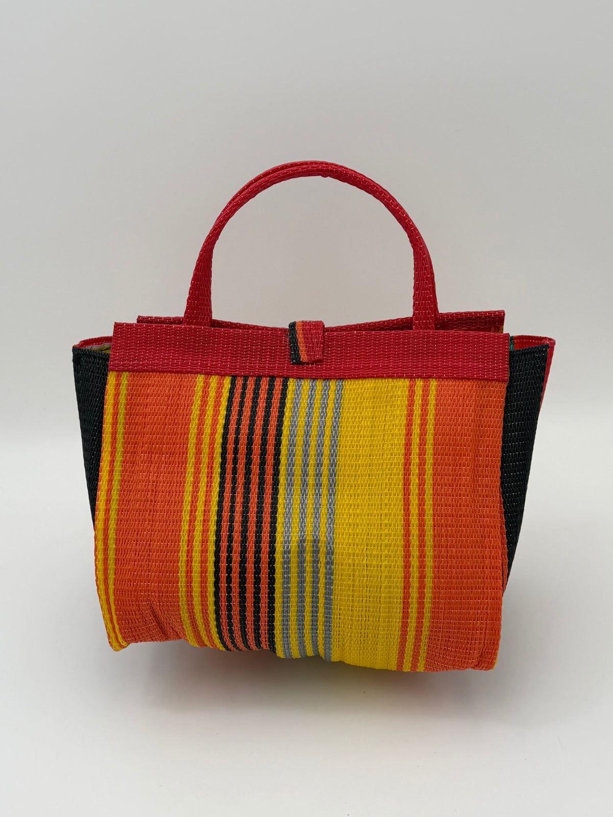 Citrus Medium  handwoven tote bag by SCRUBIES in Orange,Red,Yellow,Green,Black with Stripes design and Almond accent pattern
