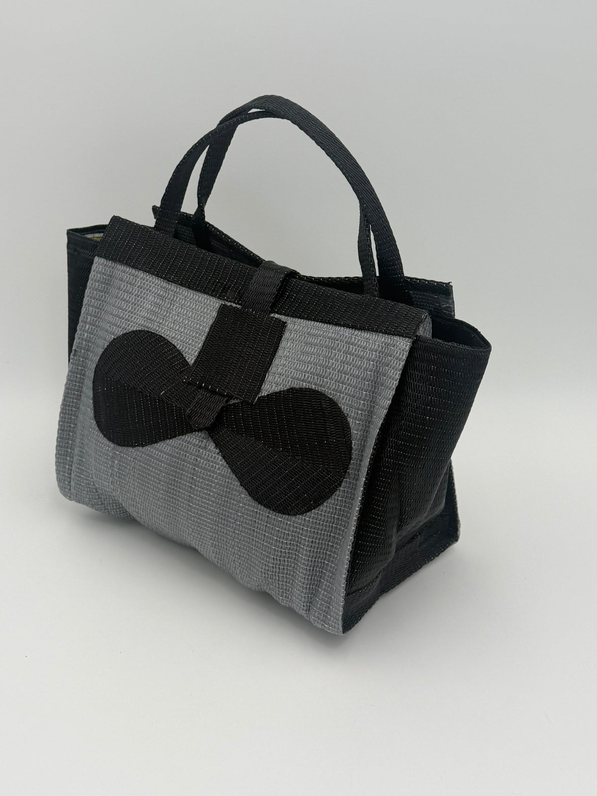 Silver Medium  handwoven tote bag by SCRUBIES in Gray,Black with Solid design and Bow accent pattern