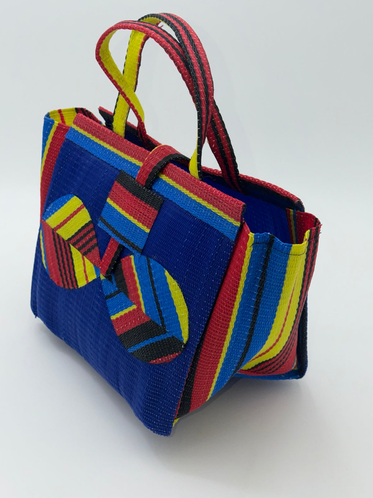 Berry Medium  handwoven tote bag by SCRUBIES in Blue,Red,Yellow,Black, with Solid design and Bow accent pattern