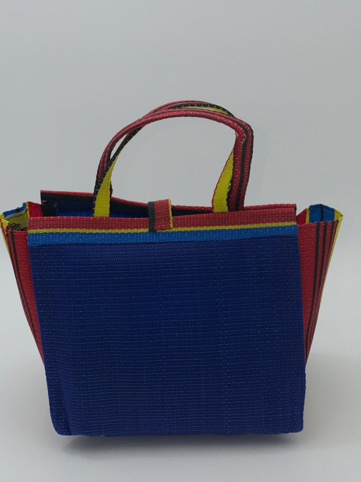 Berry Medium  handwoven tote bag by SCRUBIES in Blue,Red,Yellow,Black, with Solid design and Bow accent pattern