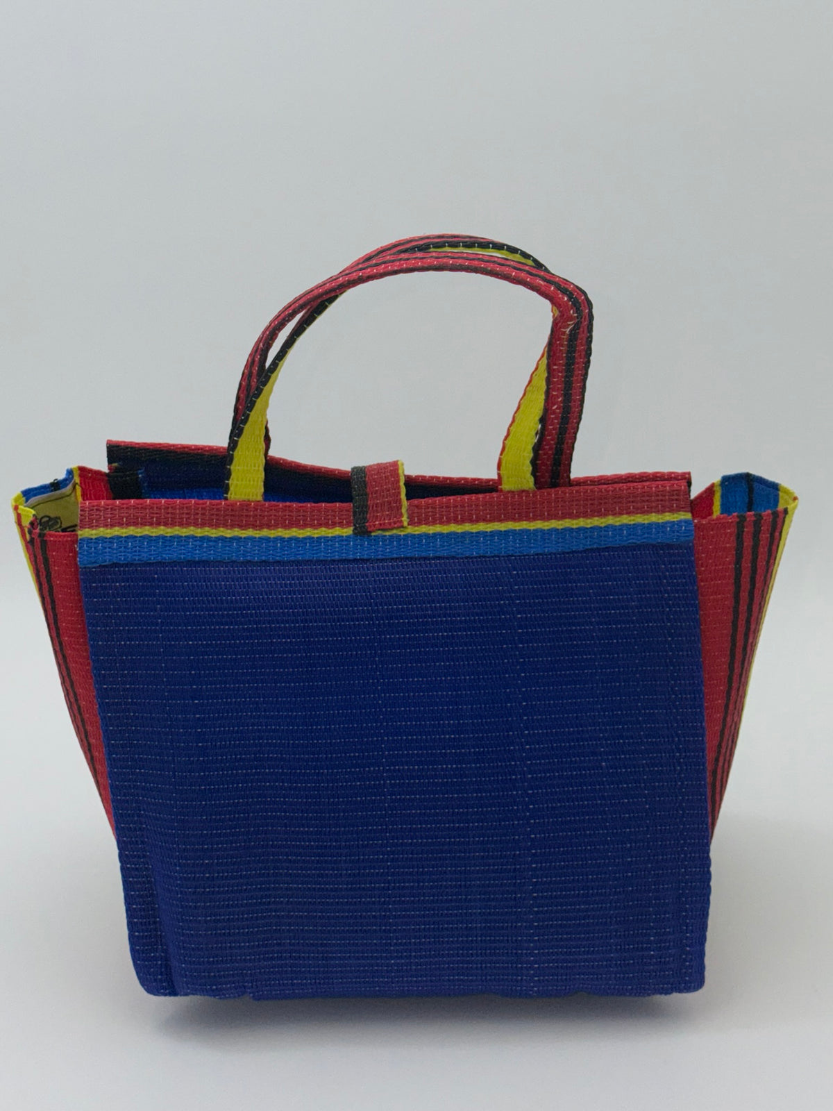 Berry Medium  handwoven tote bag by SCRUBIES in Blue,Red,Yellow,Black, with Solid design and Bow accent pattern