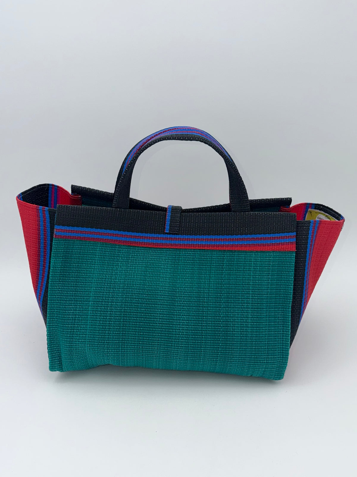 Emerald Large handwoven tote bag by SCRUBIES in Green,Red,Black,Blue with Solid design and Bow accent pattern
