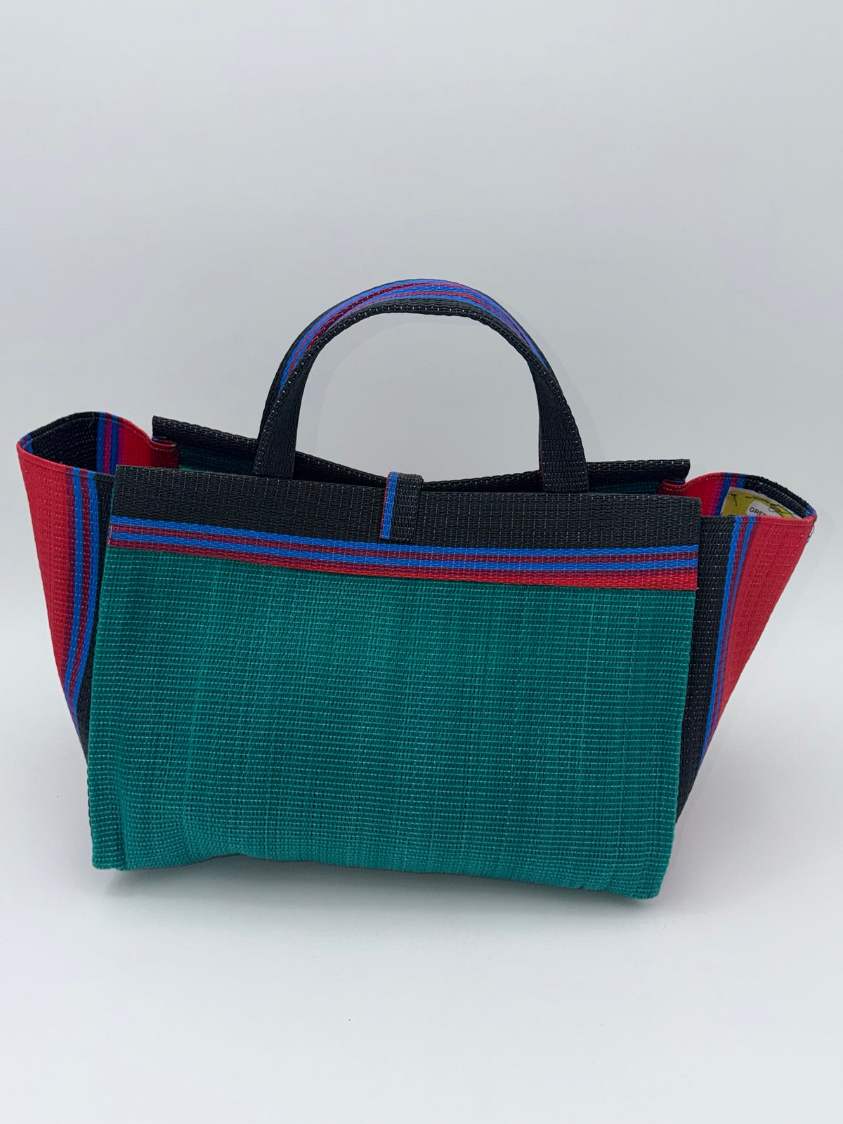 Emerald Large handwoven tote bag by SCRUBIES in Green,Red,Black,Blue with Solid design and Bow accent pattern